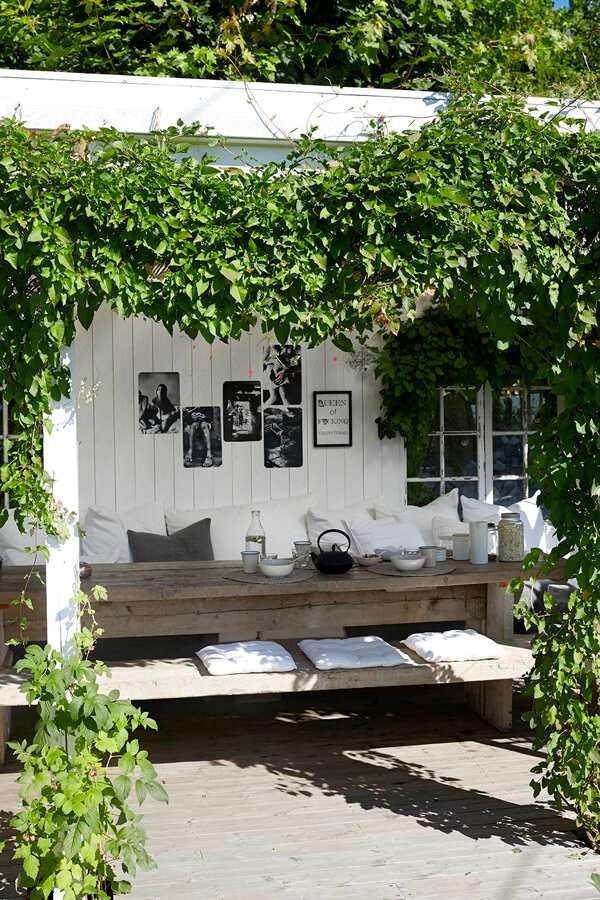 Outdoor seating with linen cushions Comfortable outdoor seating arranged with removable linen cushions