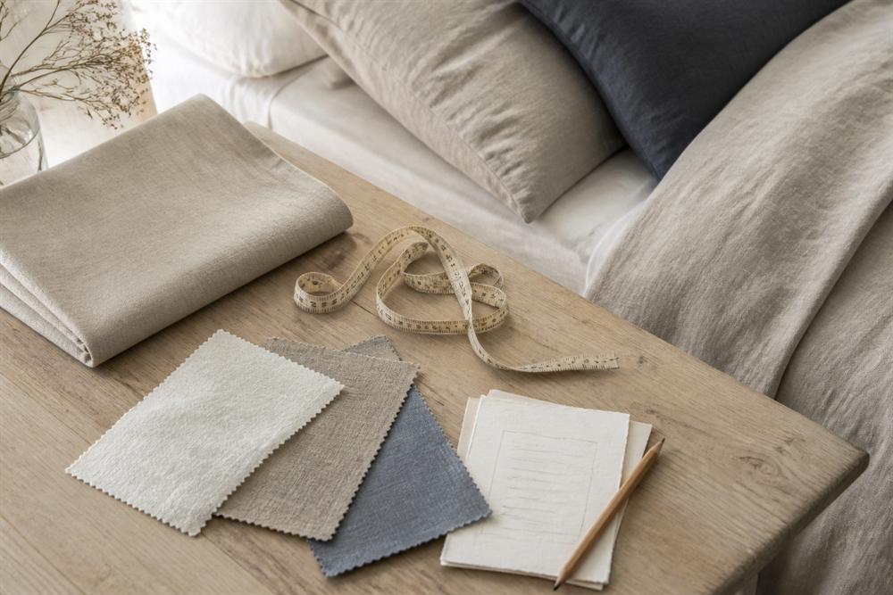 Linen swatches, tape measure and notes for choosing bed linen