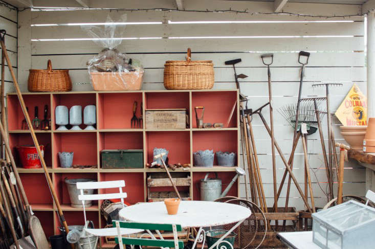Vintage baskets, garden tools and furniture in the Secret Herb Garden shop