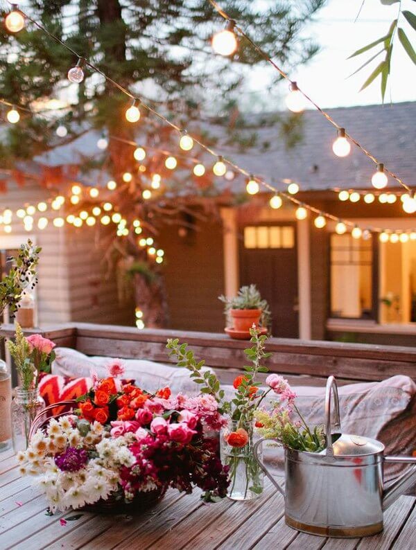 Layered lighting for an outdoor space Warm outdoor lighting arranged around a terrace seating area