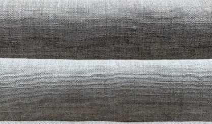 Linen upholstery fabric on a sofa being cleaned gently