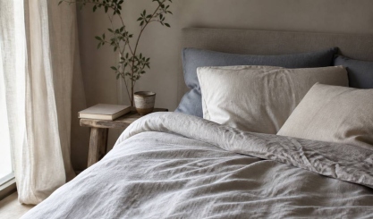 Restful bedroom with layered natural linen duvet cover and pillows