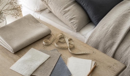 Linen swatches with a tape measure and notes for choosing bed linen