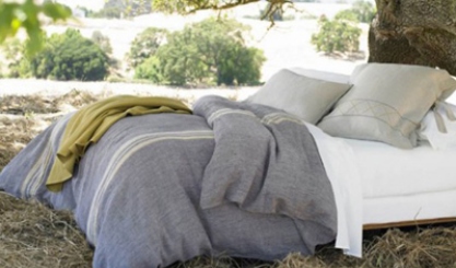 Grey and mustard pure linen bedding in a relaxed bedroom