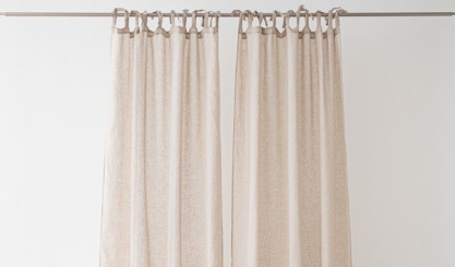 Sheer natural linen curtains showing a light, airy drape