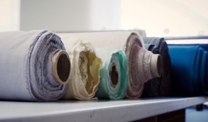 Fabric seam puckering beside a sewing machine stitch line
