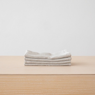 Stack of grey linen napkins for a monochrome table setting