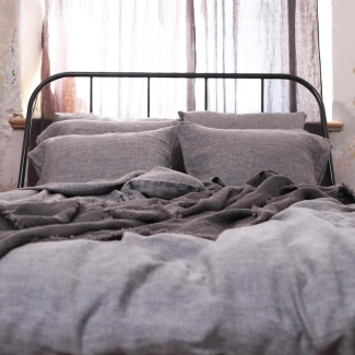 Linen bedding with fabric swatches and a ruler for choosing material and size
