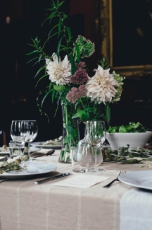 Natural linen tablecloth and napkins arranged for washing and stain care